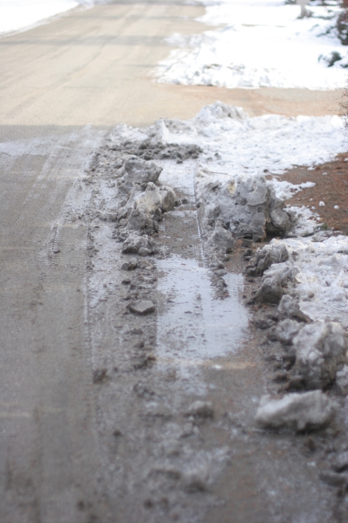 tire tracks frozen in the snow drift | east kelowna